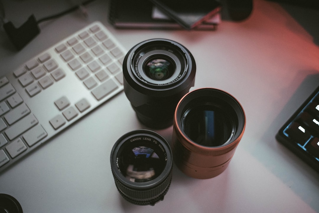 black camera lens on white table