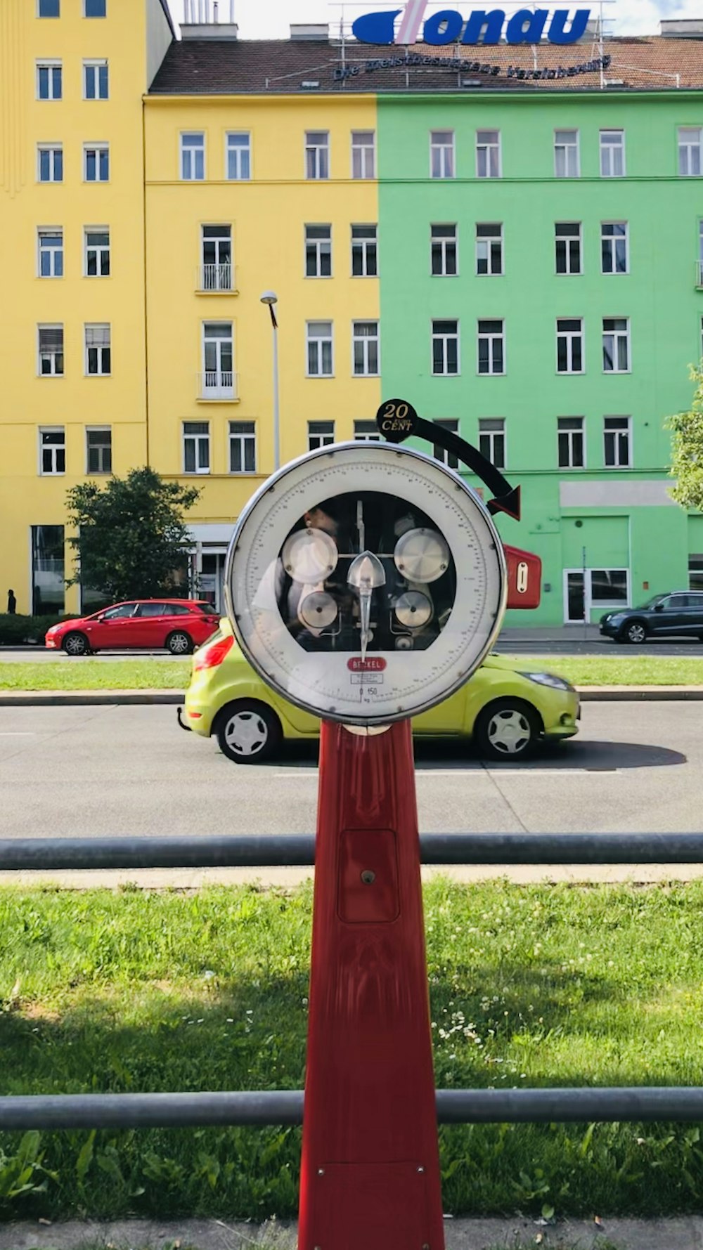 red and white analog weighing scale