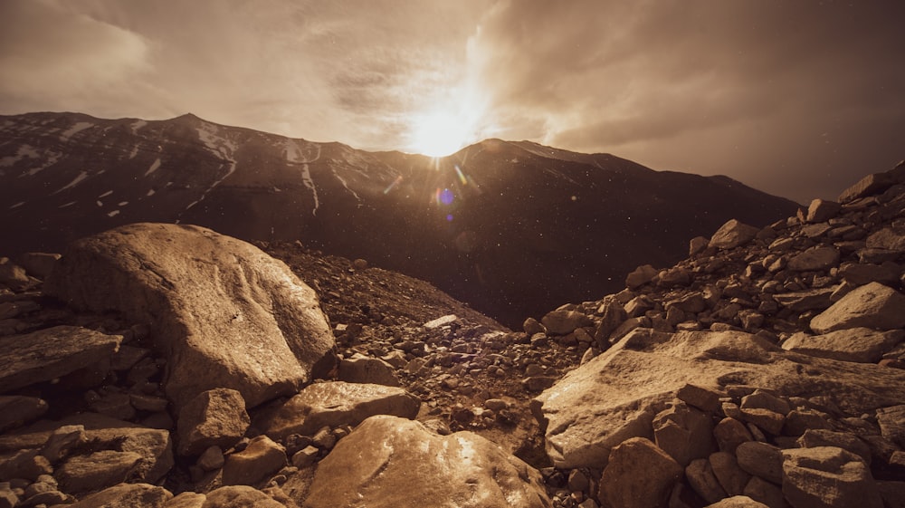 rocky mountain under cloudy sky during daytime