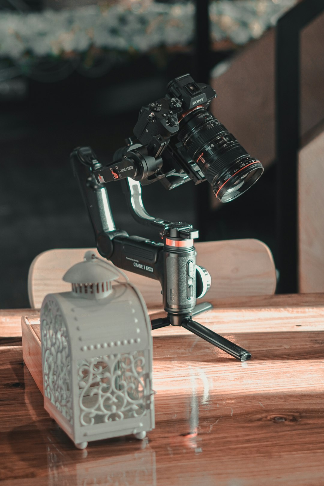 black dslr camera on brown wooden table