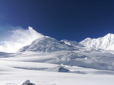 A majestic mountain landscape with a clear blue sky.
