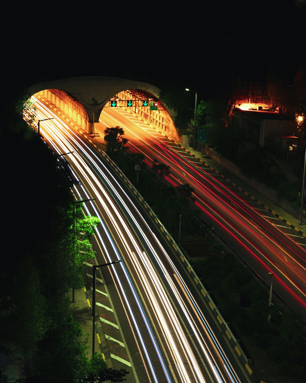 time lapse photography of cars on road during night time