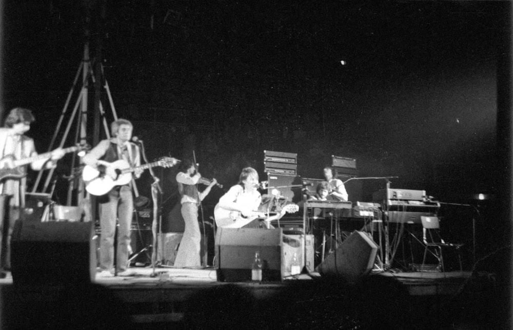 man playing guitar on stage