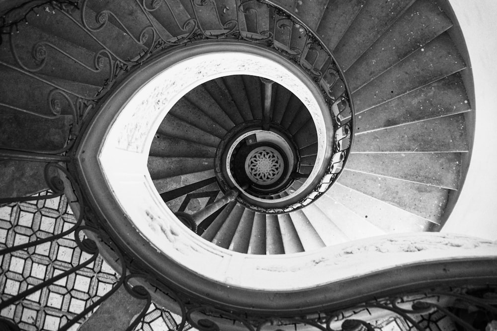 grayscale photo of spiral staircase