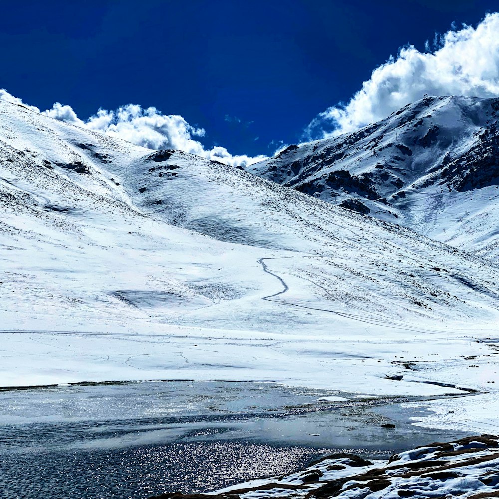 snow covered mountain under blue sky during daytime