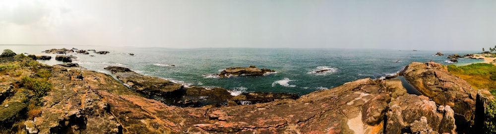 brown rock formation on sea during daytime