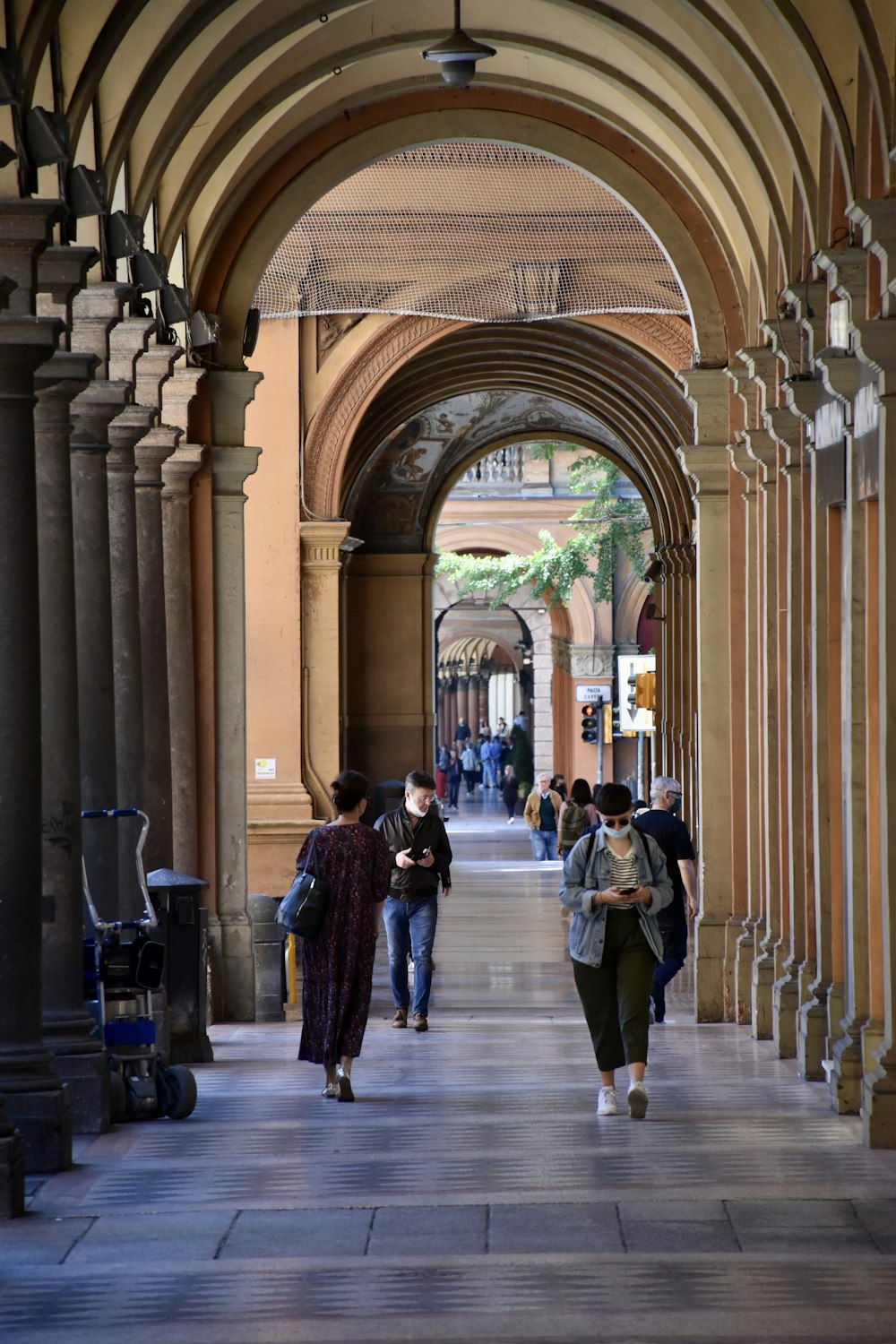 people walking on hallway during daytime