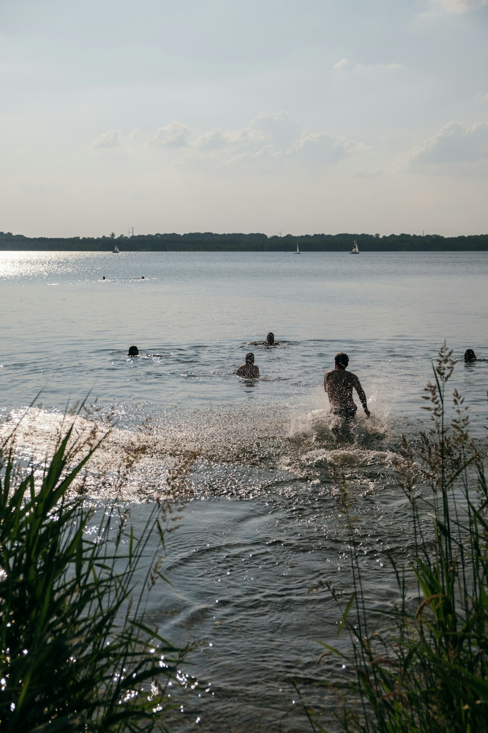 man and woman sitting on water during daytime