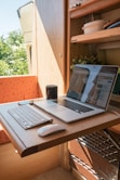 macbook pro on brown wooden table