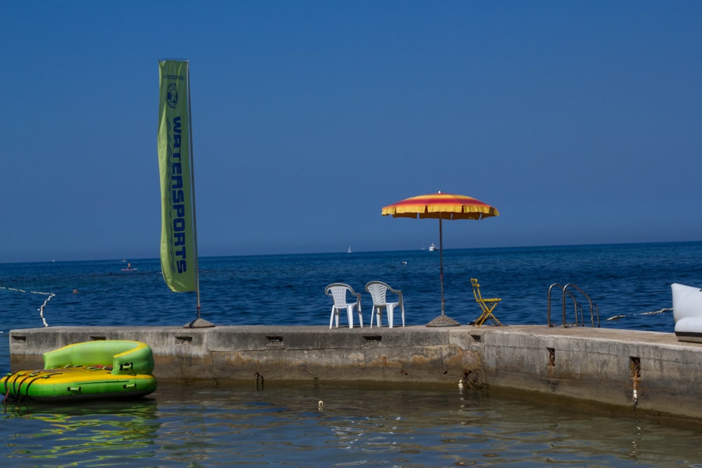 green kayak on body of water during daytime