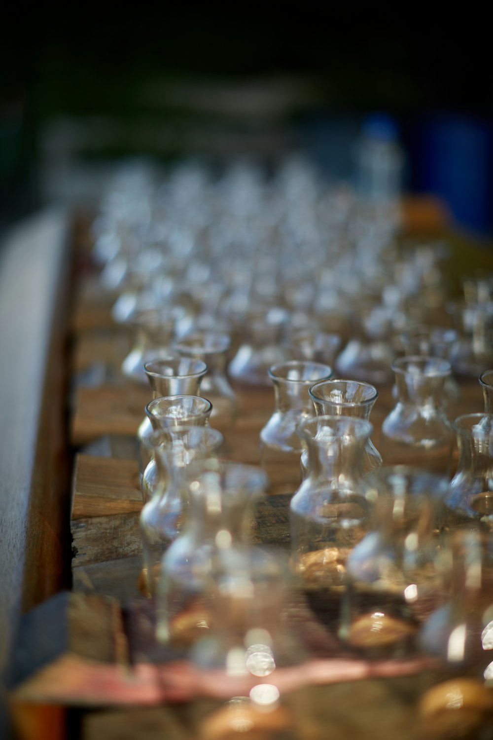 clear glass chess piece on brown wooden table