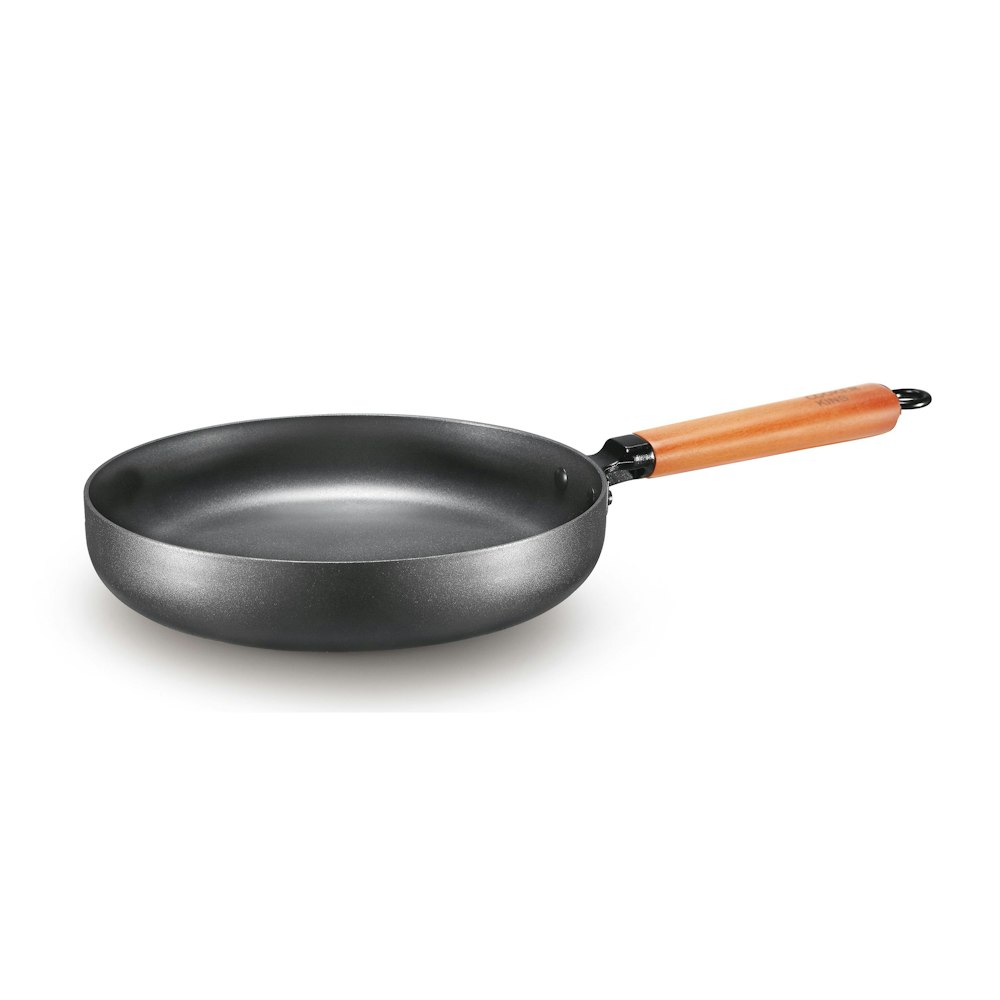 black frying pan on white surface