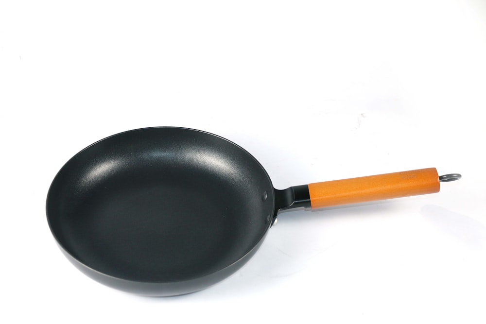 black and orange frying pan