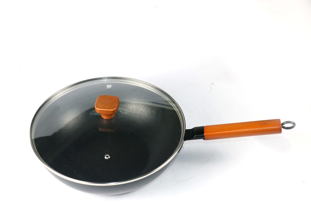 black and orange frying pan