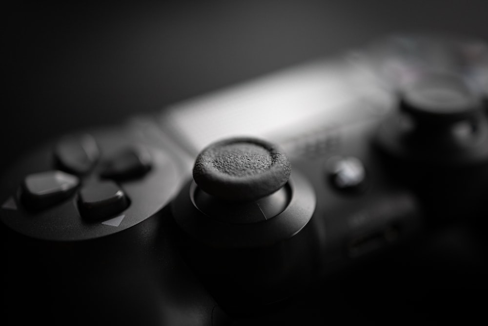 black game controller on black surface