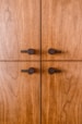 black round buttons on brown wooden surface