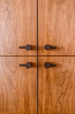 black round buttons on brown wooden surface