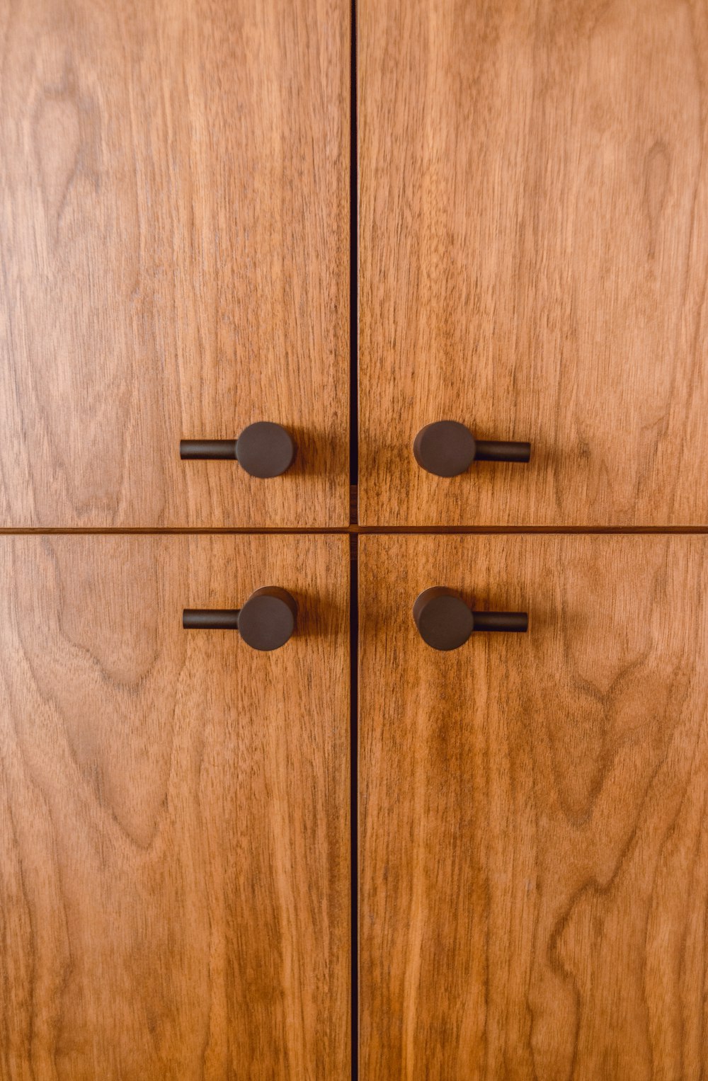 black round buttons on brown wooden surface