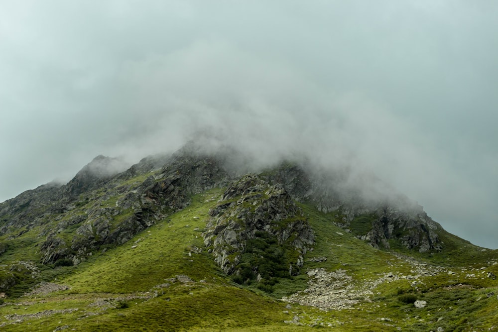 green mountain under white clouds during daytime