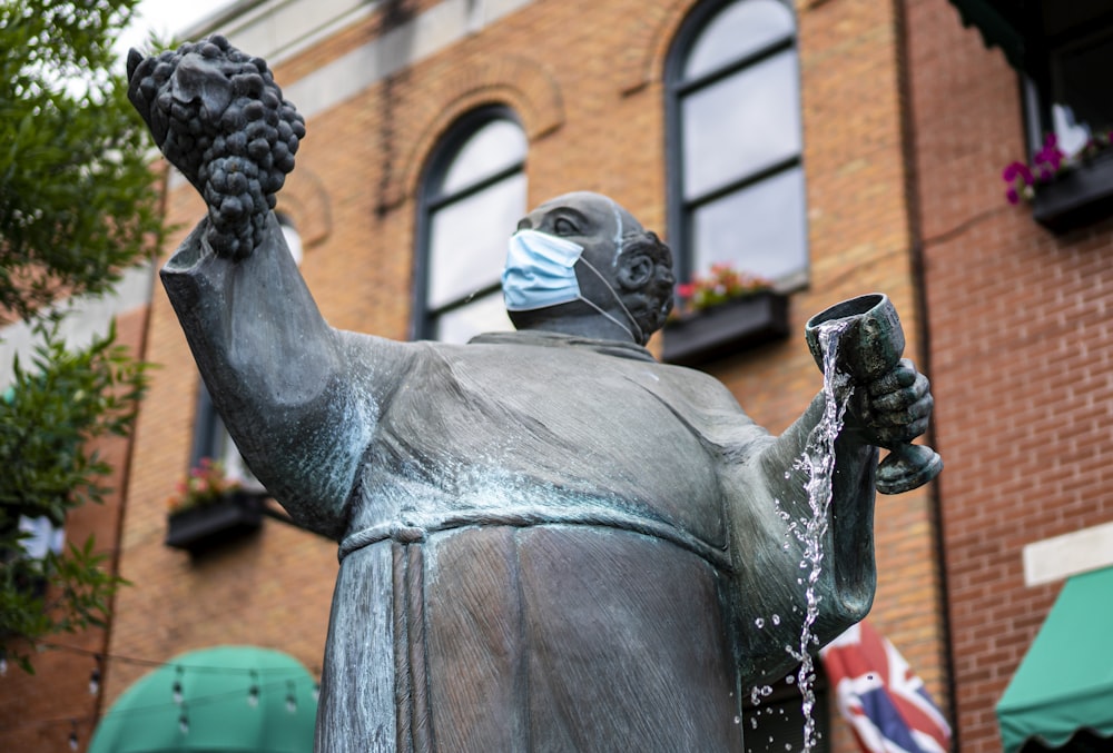 man in black suit statue