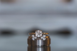 Close-up of a sparkling 14k gold engagement ring with a brilliant diamond centerpiece