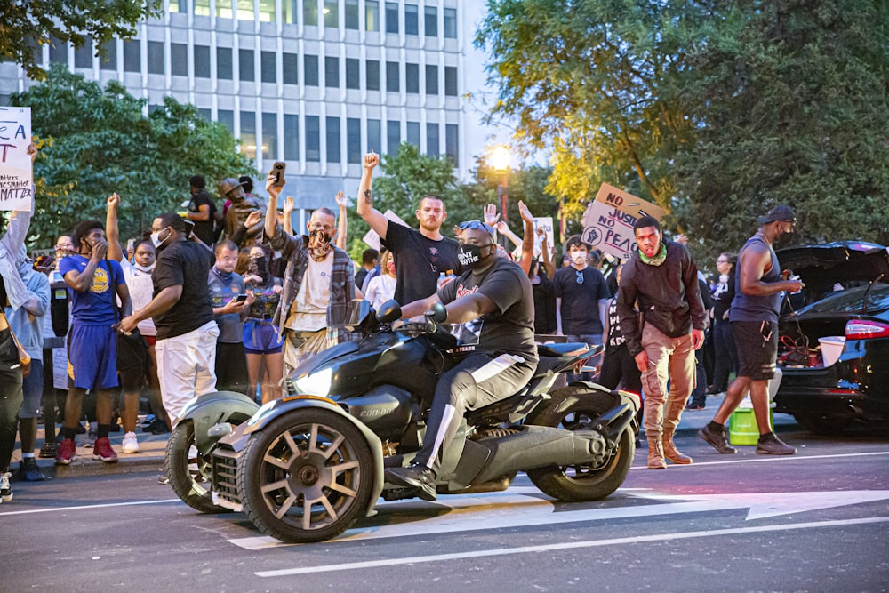 people riding on motorcycle during daytime