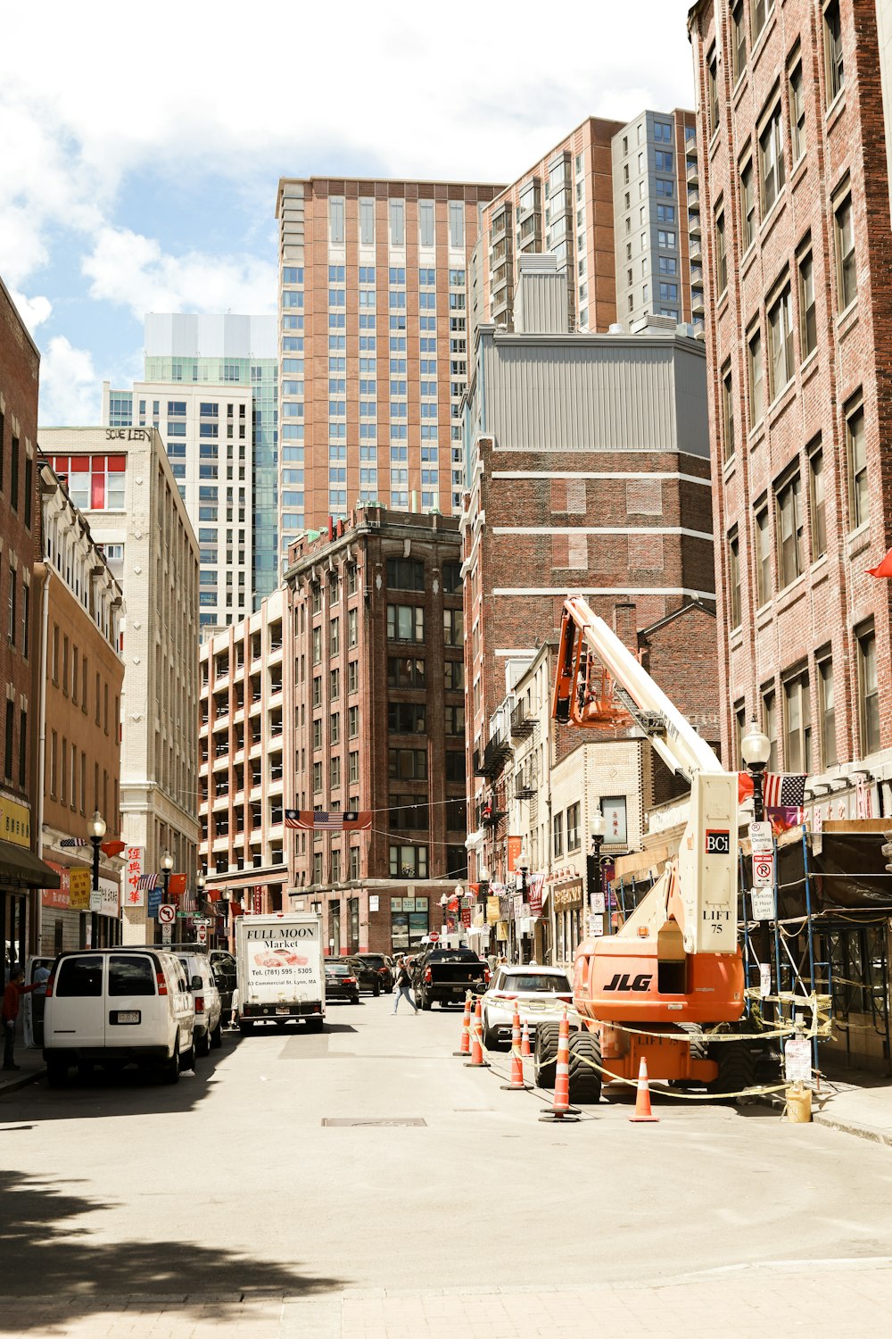 cars parked on street near buildings during daytime