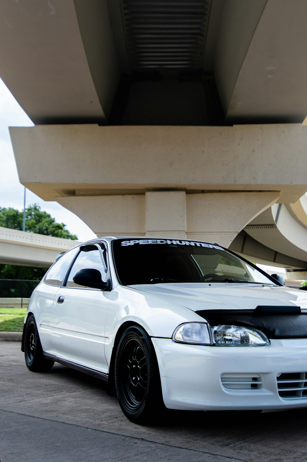 silver bmw m 3 coupe parked near white building