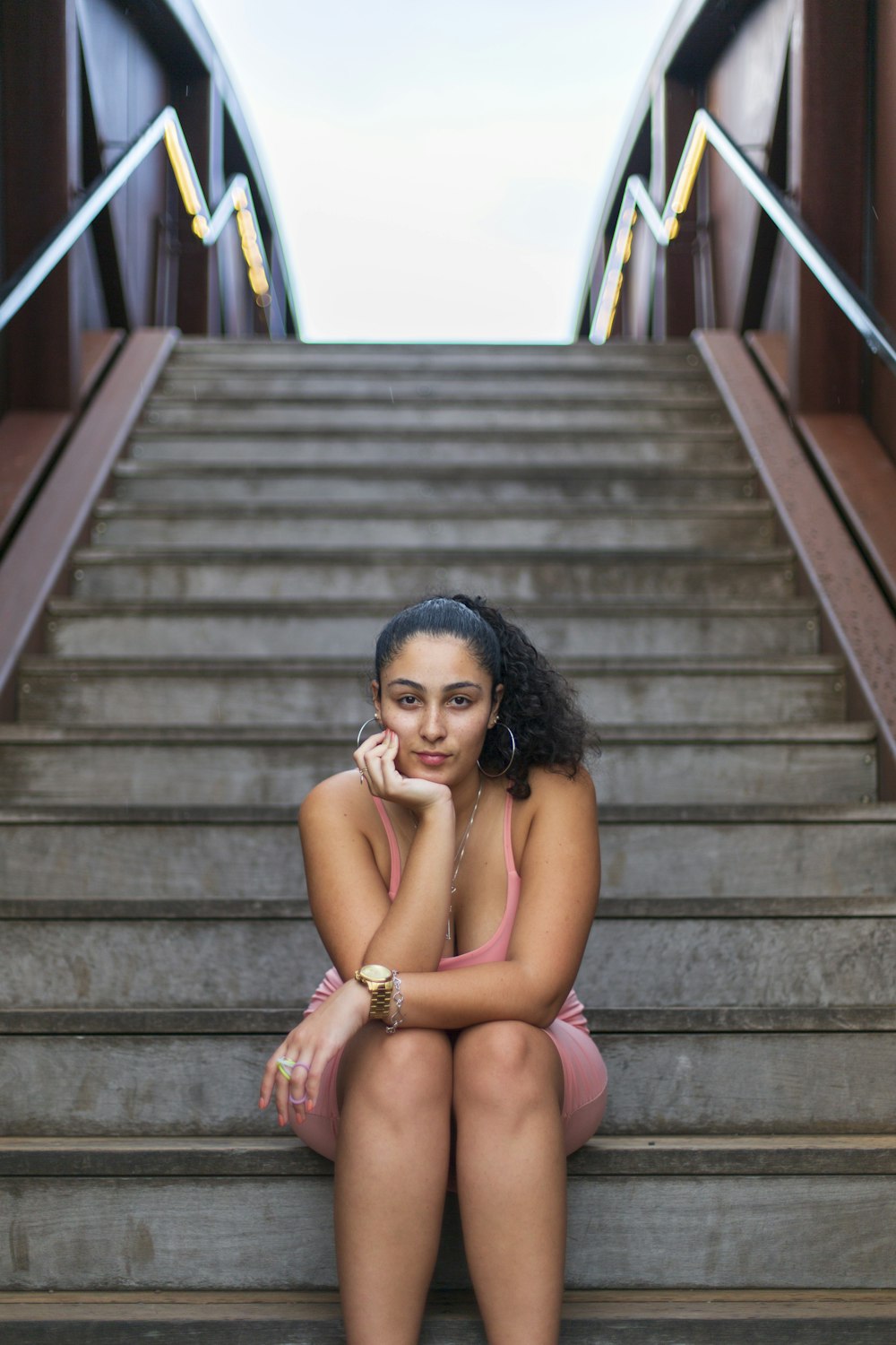 woman in pink panty sitting on stairs