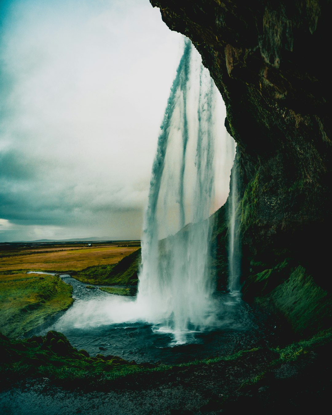 water falls under gray sky