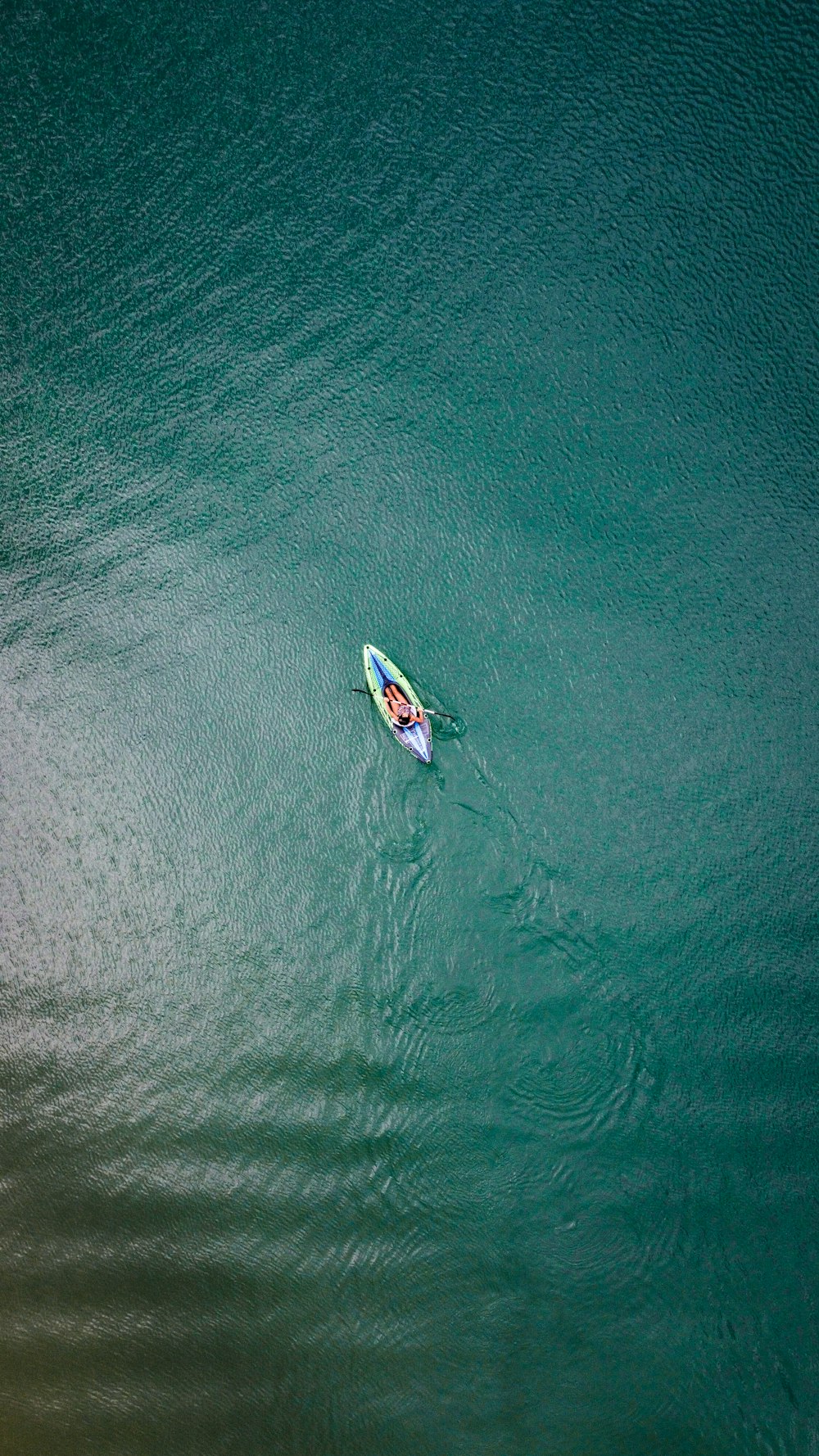 white and blue boat on sea during daytime