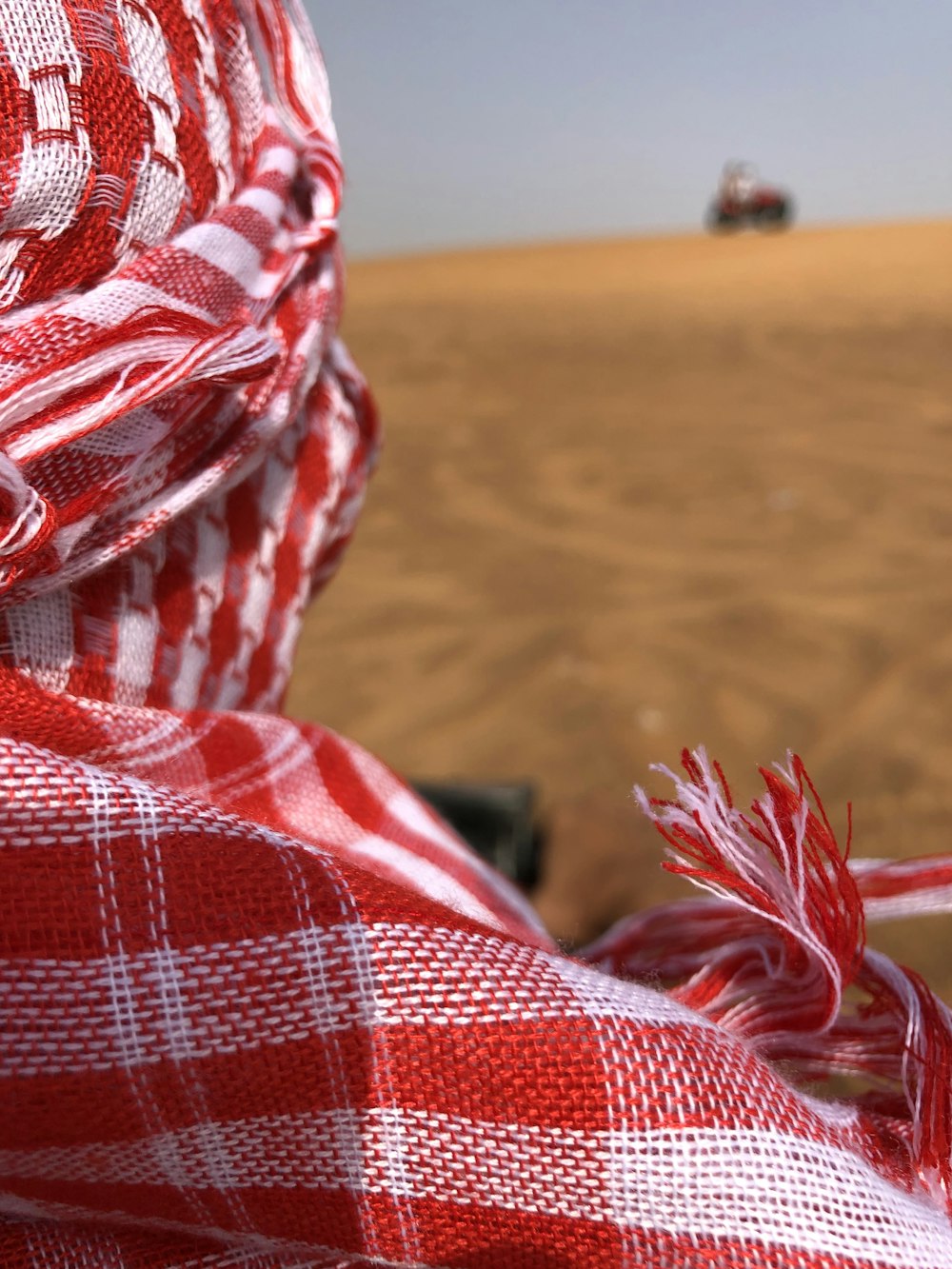 red and white plaid textile