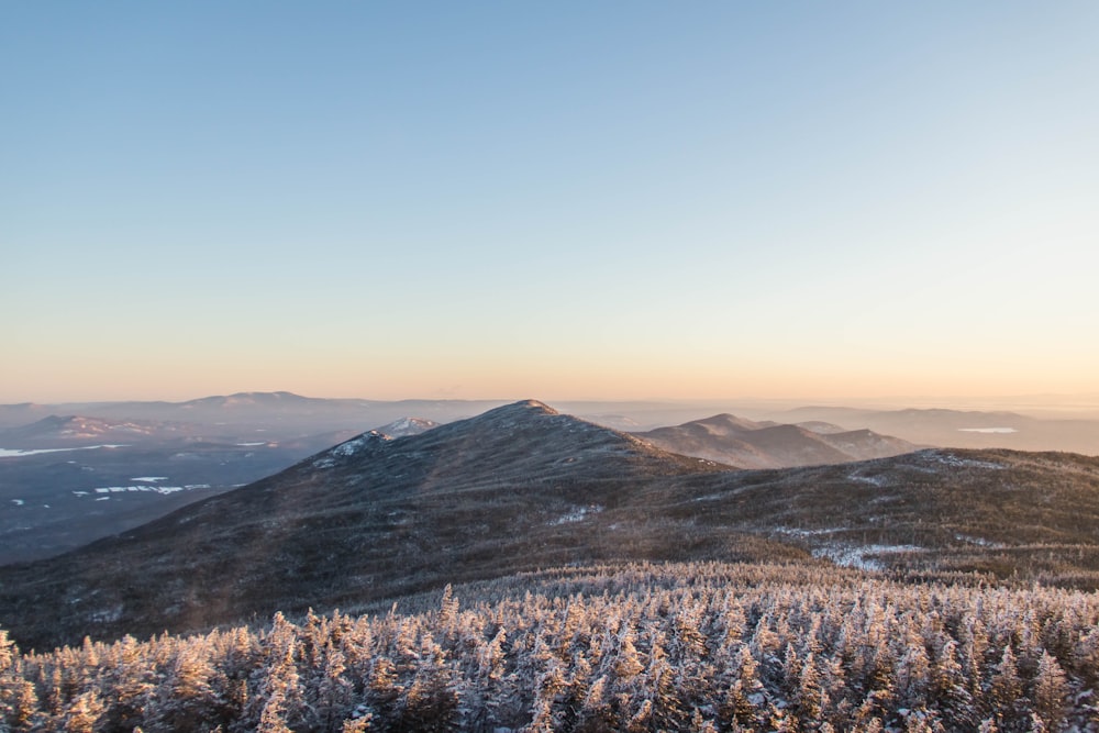 brown and green mountains under blue sky during daytime