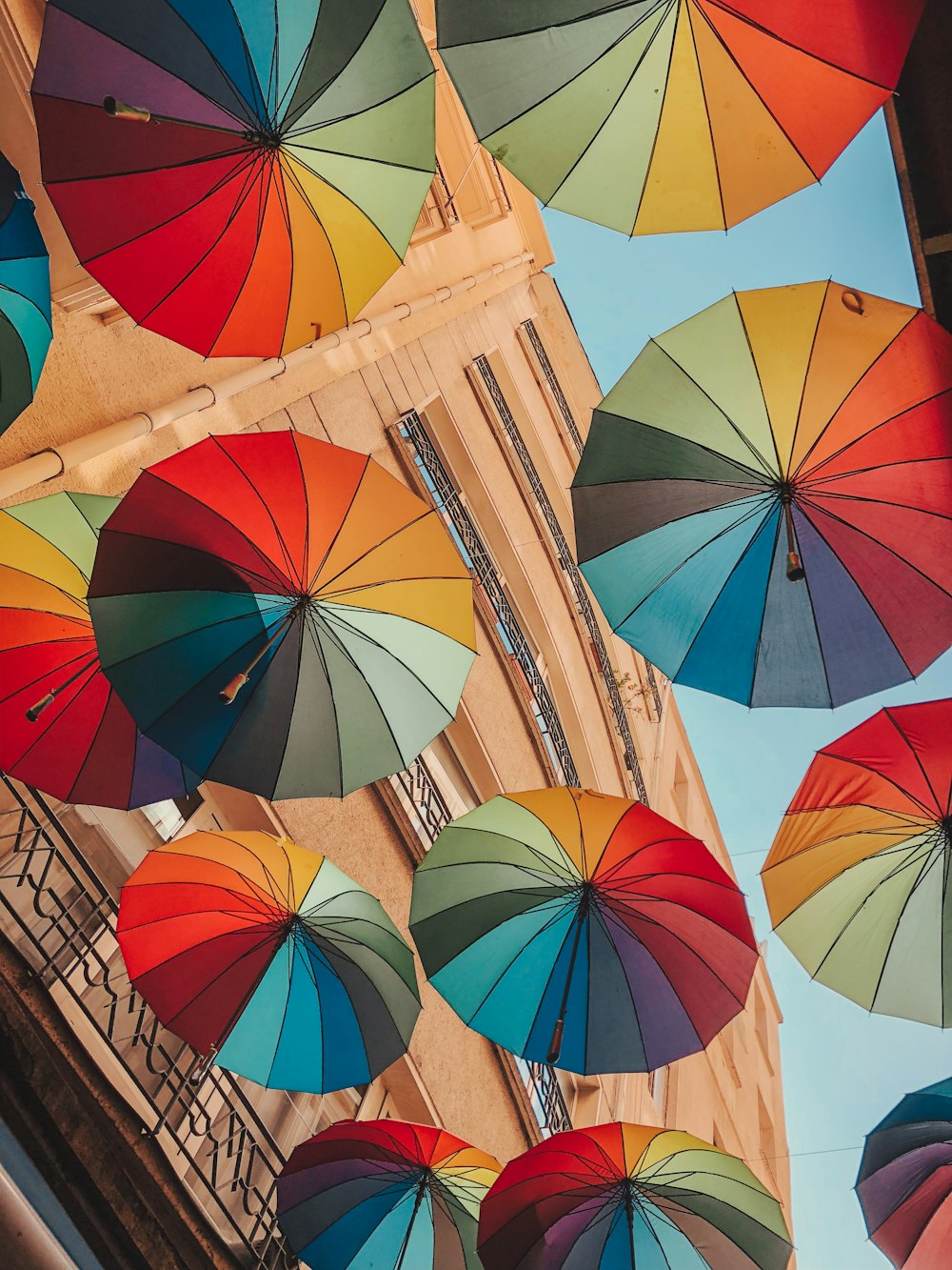 low angle photography of umbrella umbrellas under blue sky during daytime