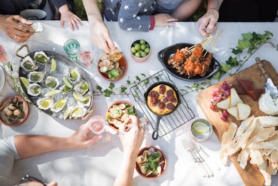 people holding clear drinking glasses lunch teams background