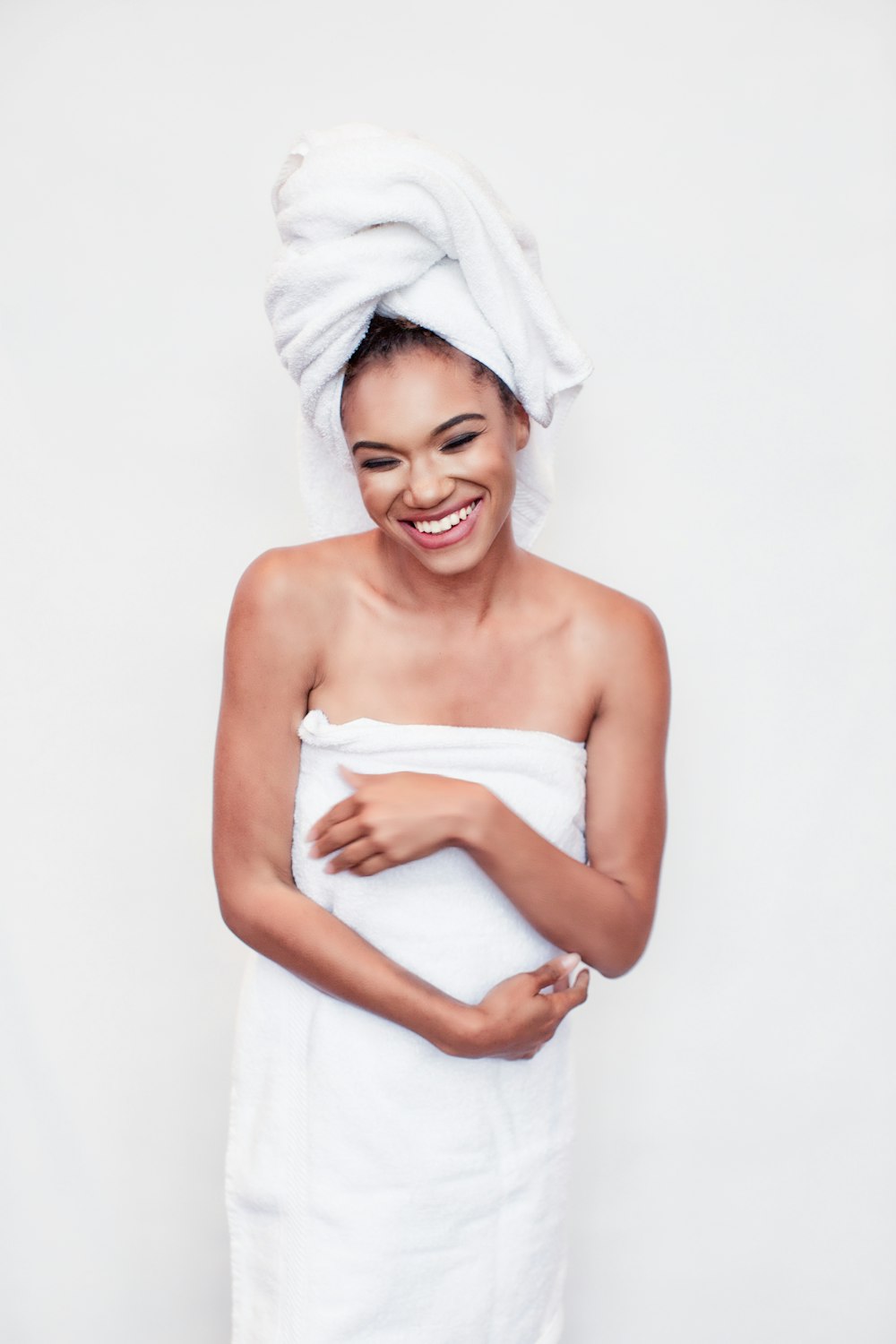 woman in white towel smiling