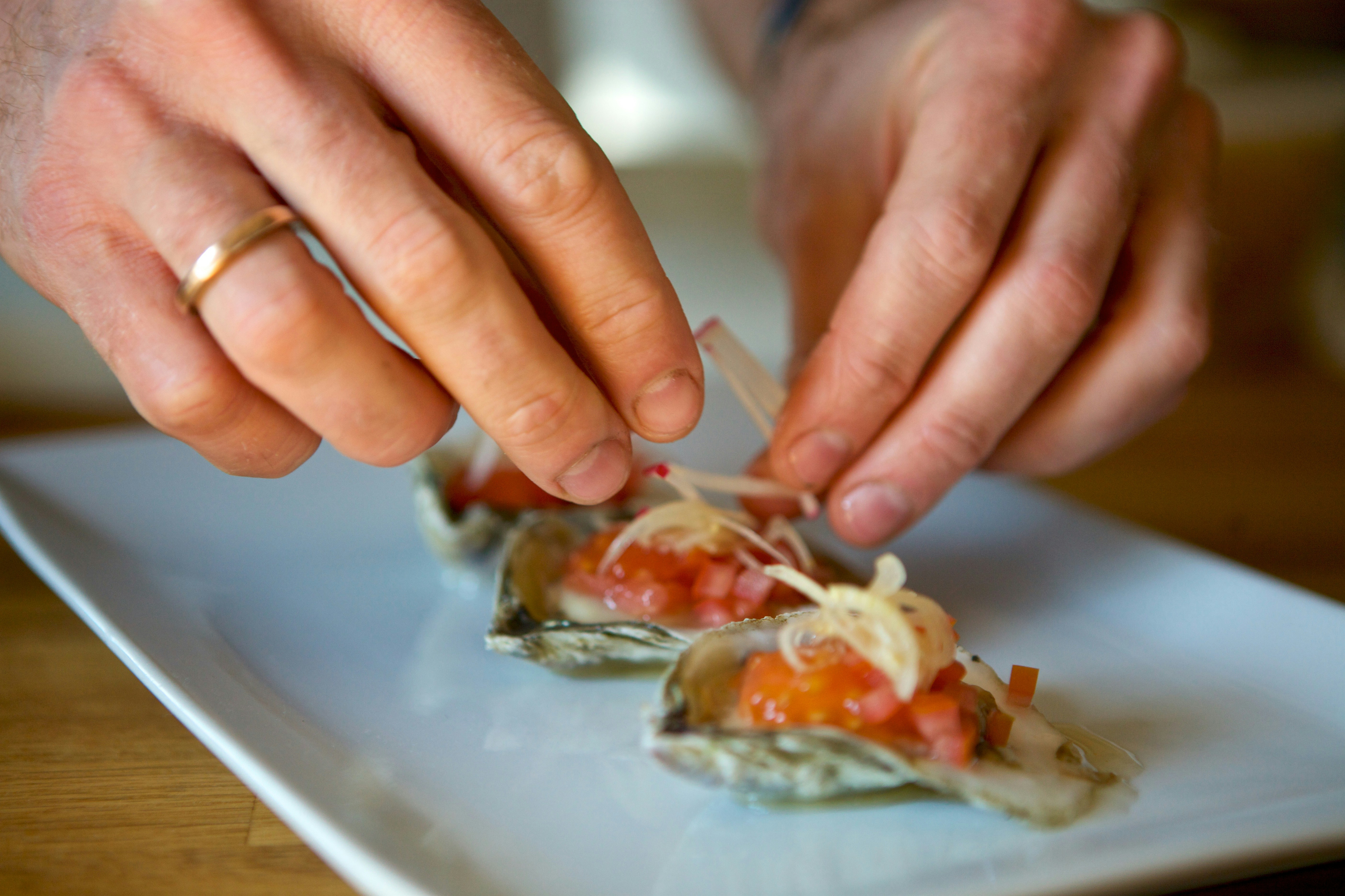 chef plating seafood dish