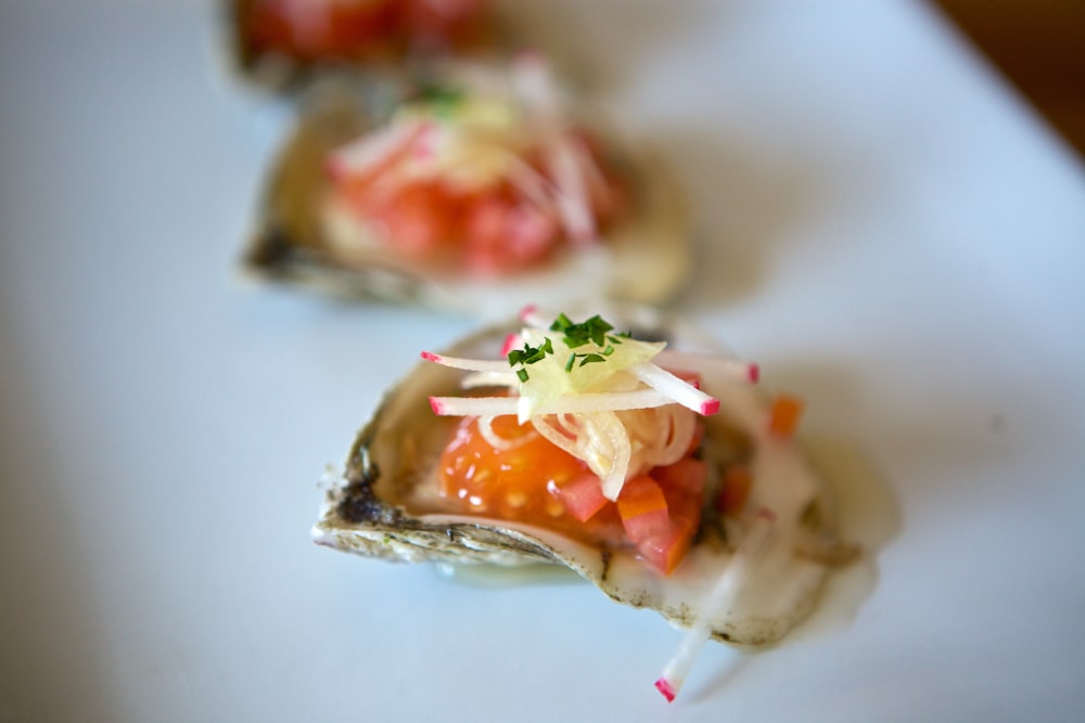 cooked food with green leaf on white ceramic plate