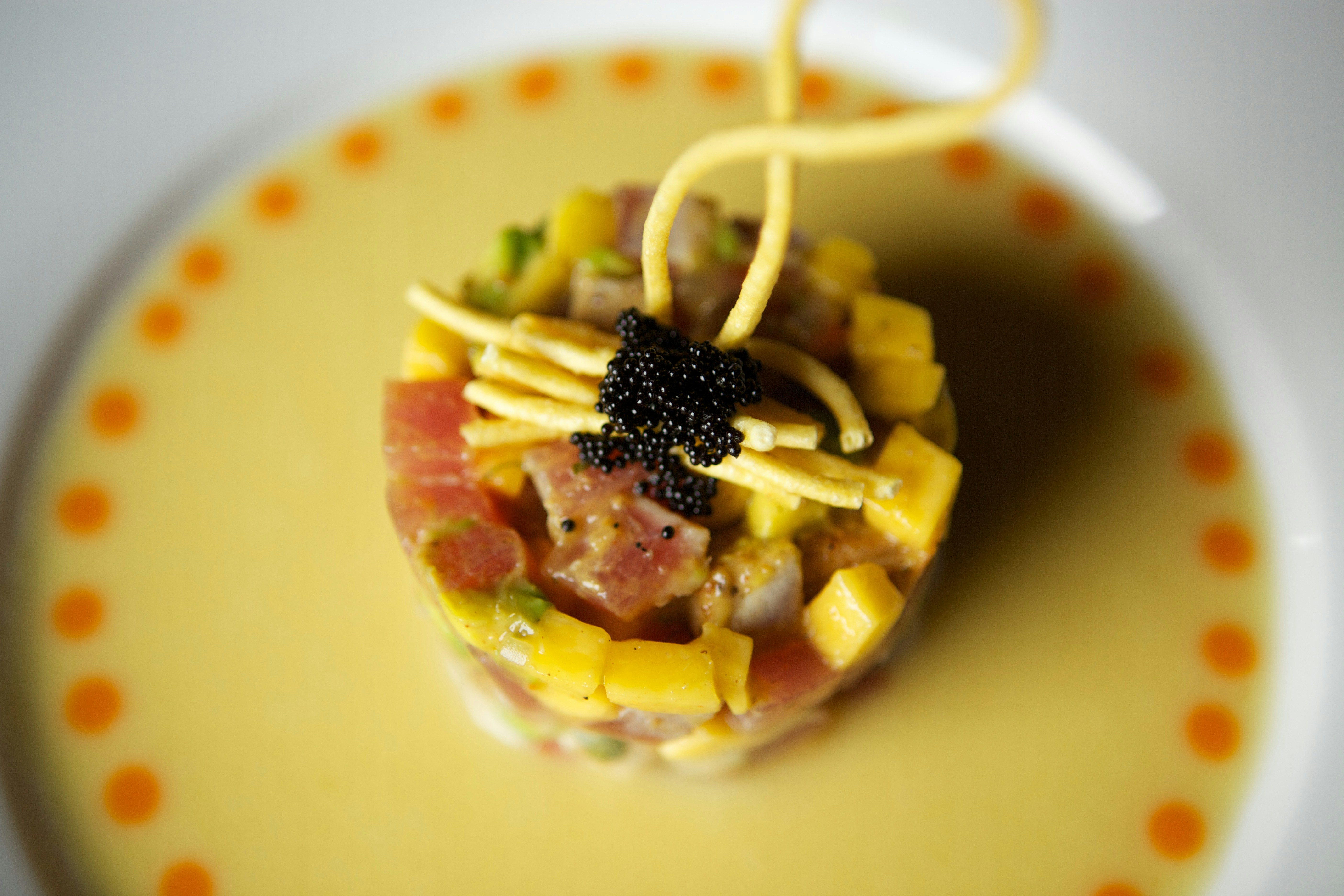 white ceramic bowl with yellow liquid