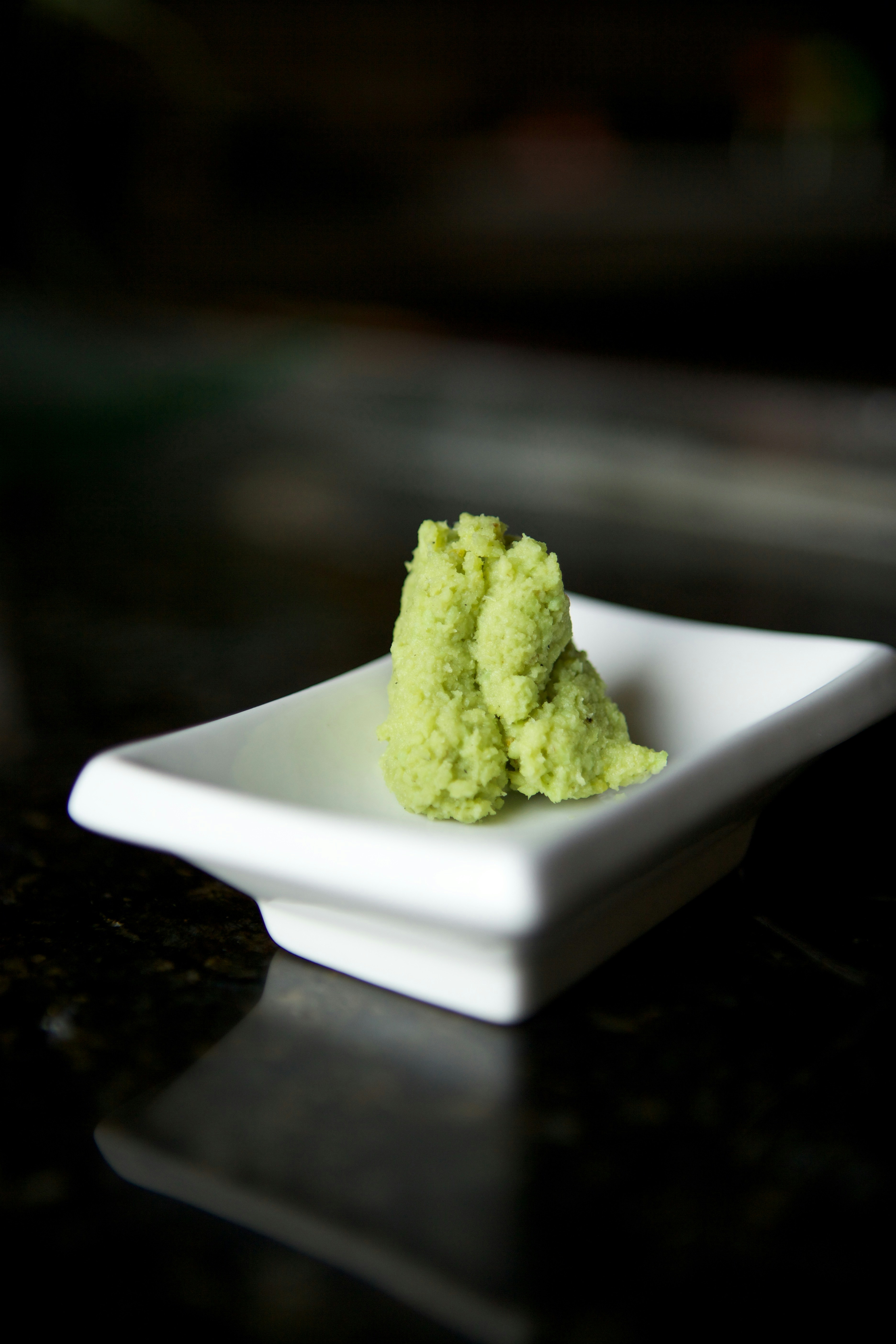 green powder on white ceramic plate