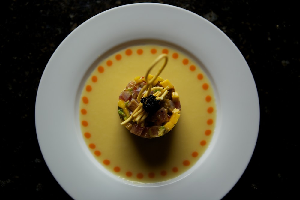 yellow liquid in white ceramic bowl