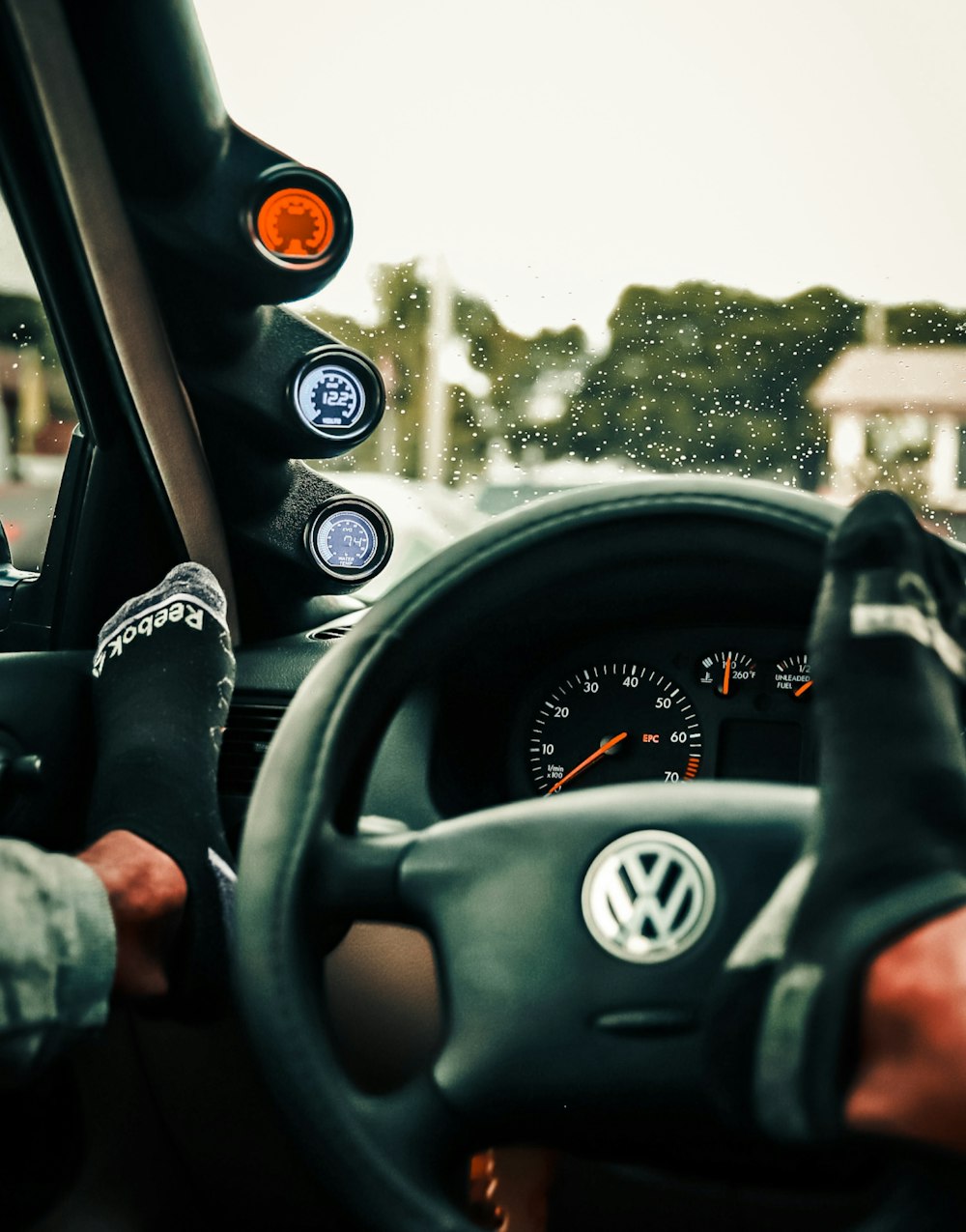 person driving car during daytime