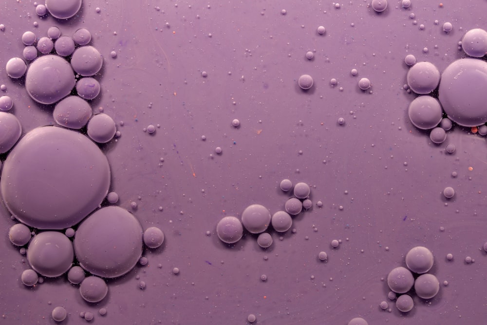 white round stones on pink surface