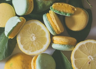 sliced lemon and green lemon on water