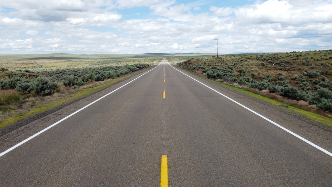 gray concrete road under blue sky during daytime, Wide Open Road<p></figure>Please give credit to "Joey Childs" if used. Thanks