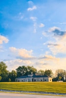 A picturesque view of a single-story home with clear windows.