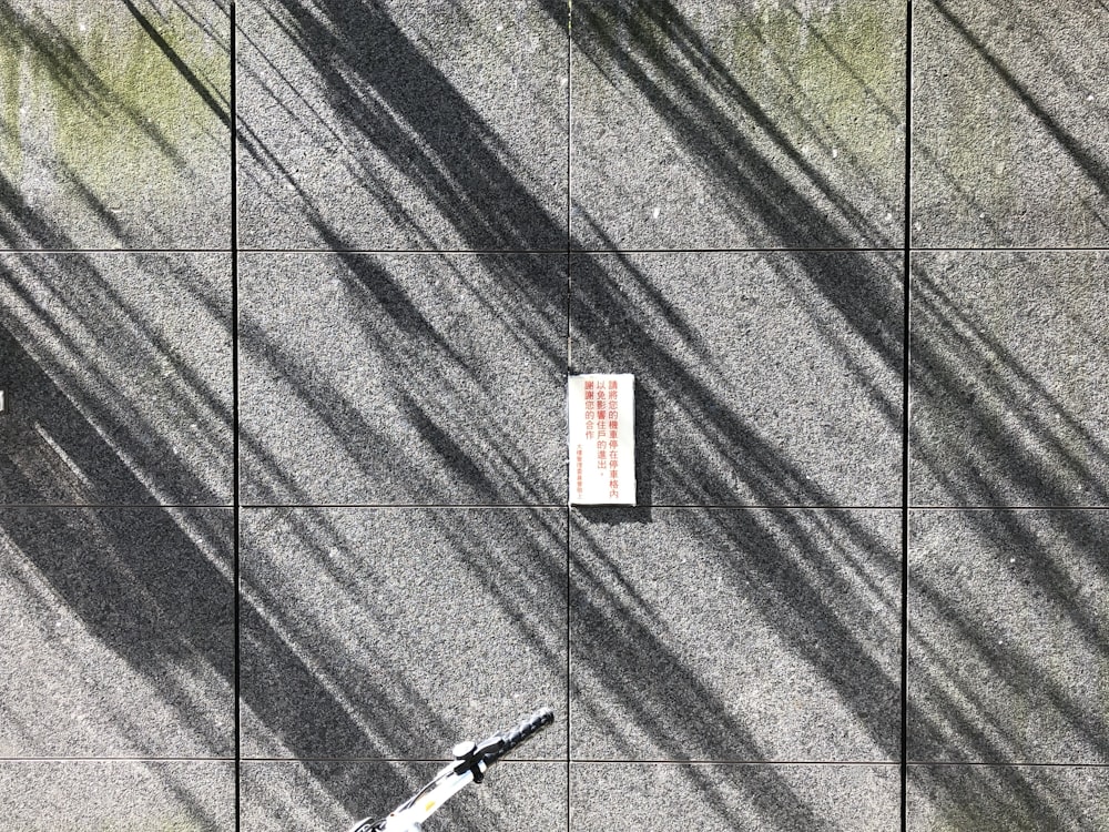 white and black box on gray textile