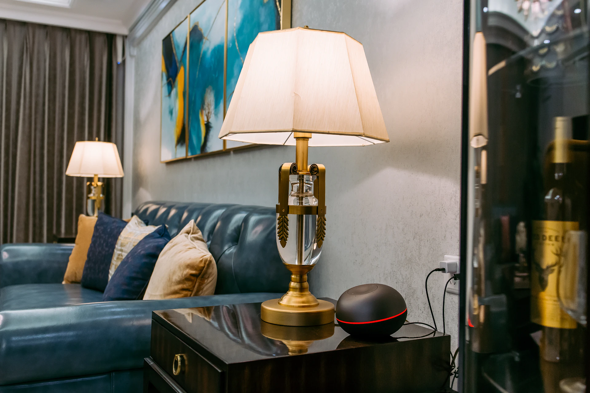 A sleek, modern living room showcasing navycraft's precise craftsmanship in a residential project, with navy blue accents and warm beige textures.