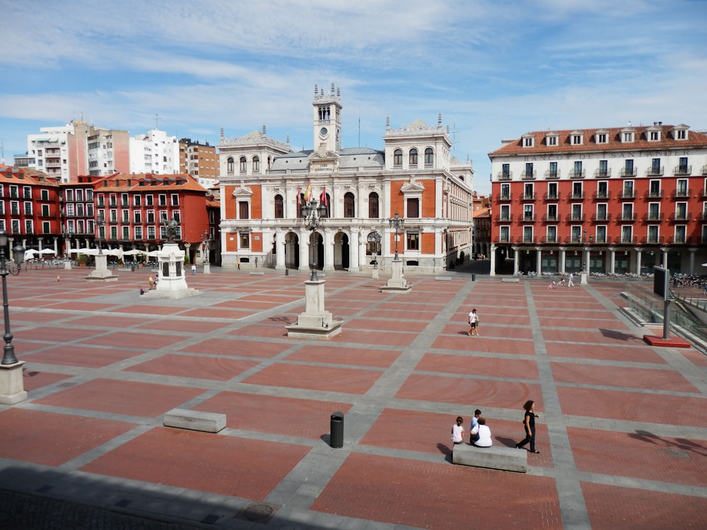 people walking on park near building during daytime