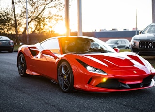 red ferrari 458 italia on road during daytime